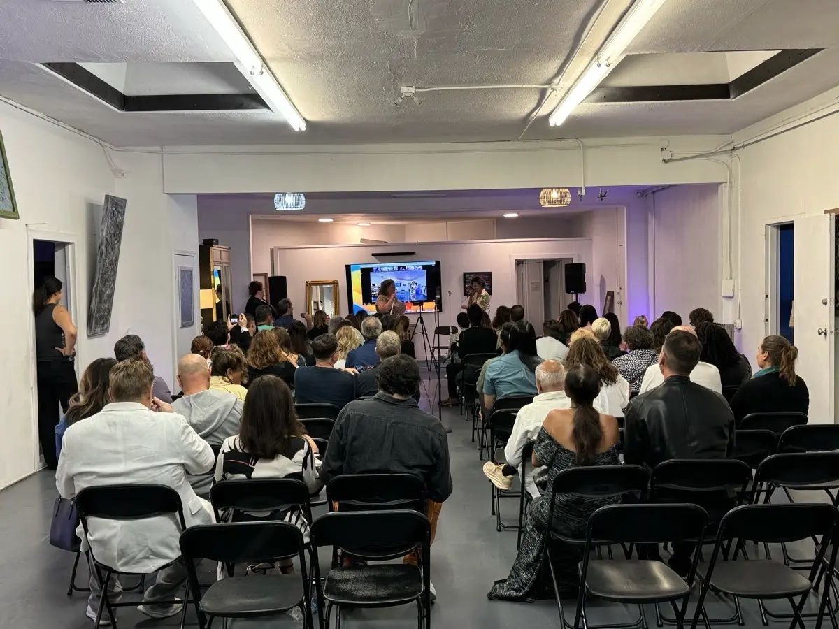 Seated audience watching a presentation on screens during a corporate event at Art and Space LA in Mid-City Los Angeles