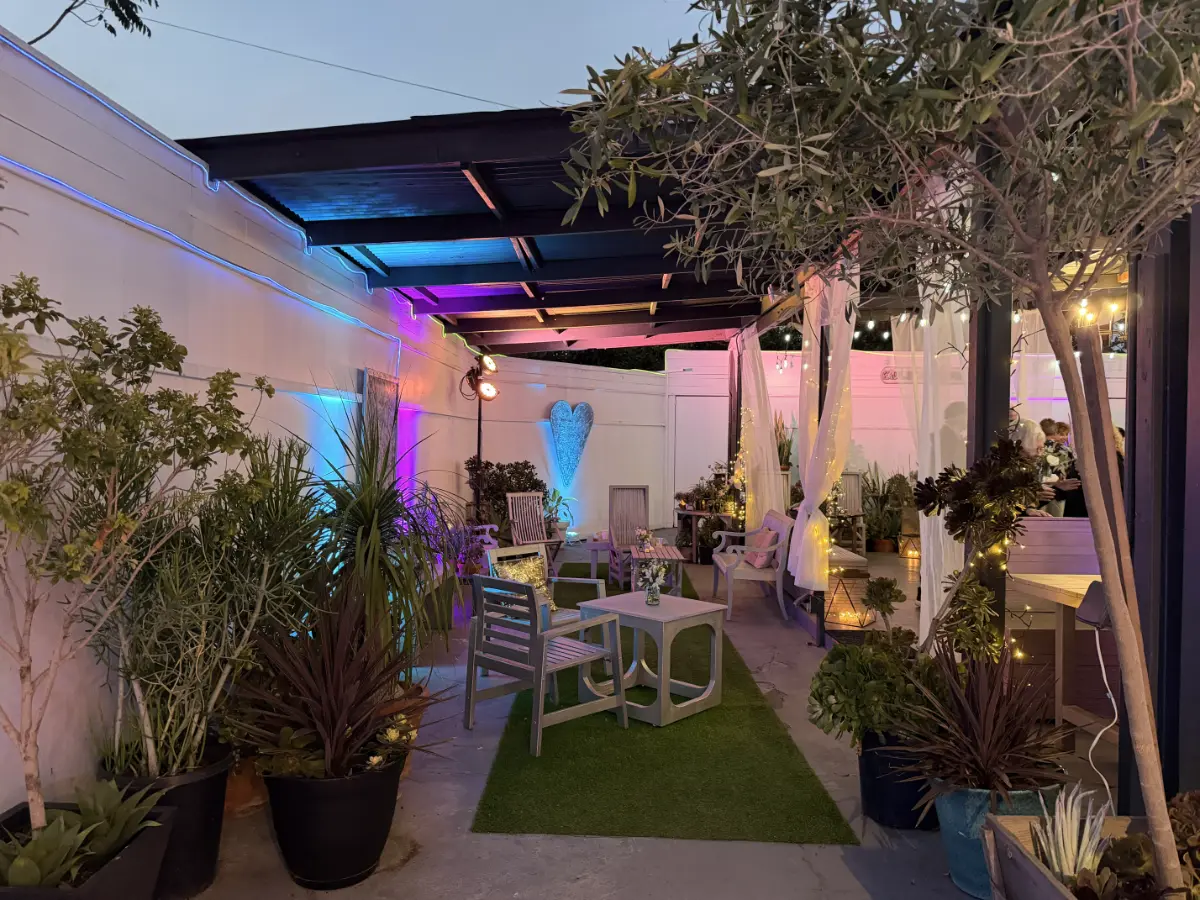 Outdoor garden lounge with ambient lighting at Art and Space LA Los Angeles