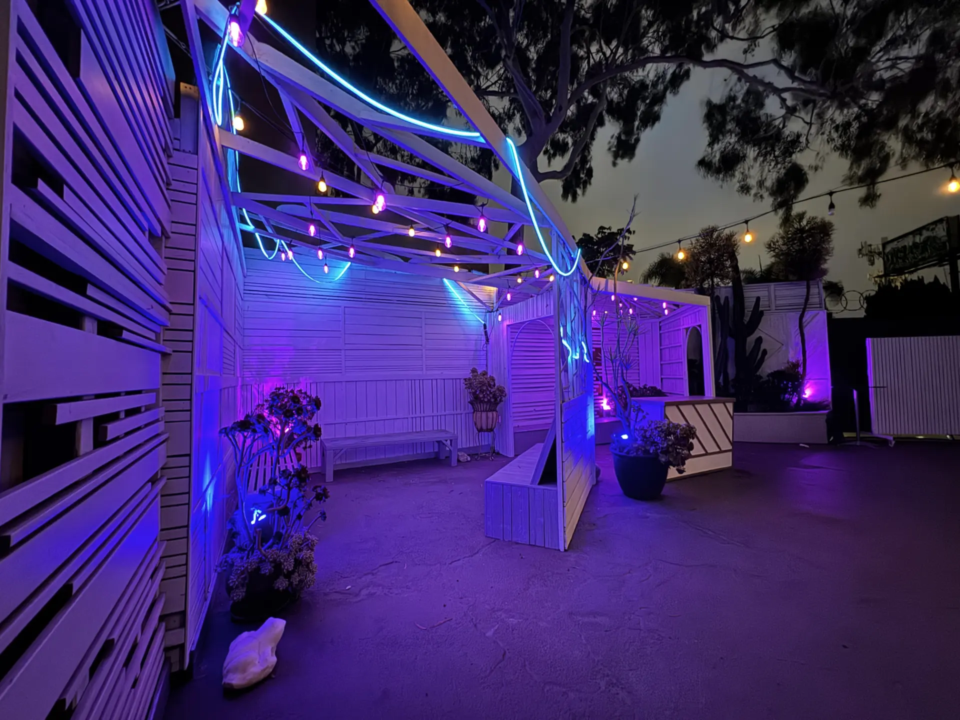 Nighttime outdoor lounge area with neon lights for a premium kids birthday party in West Adams for local families.