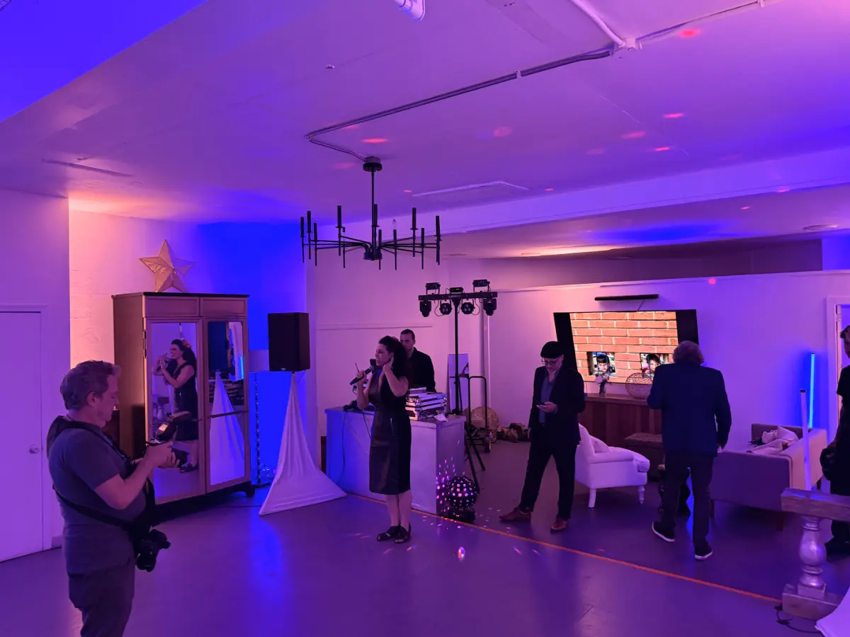 Live singer performing under purple lights at a premium Bat Mitzvah party in Pico-Robertson for professional event entertainment.