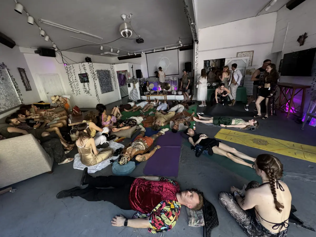 Participants lying on mats and cushions during a sound bath at Art and Space LA in Mid-City Los Angeles